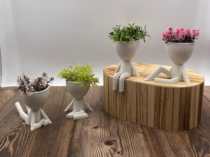 Playful Mini Humans Flower Pot with Flowers